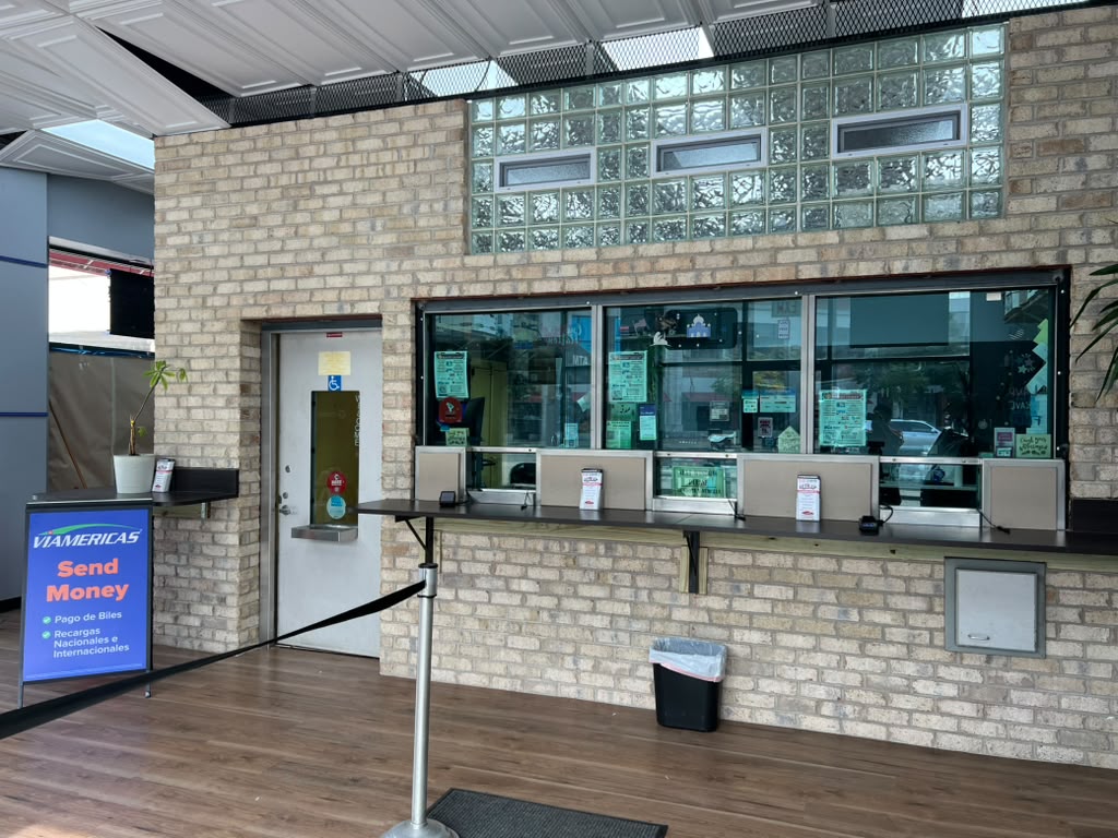 Service counter with teller windows inside New Howard Currency Exchange
